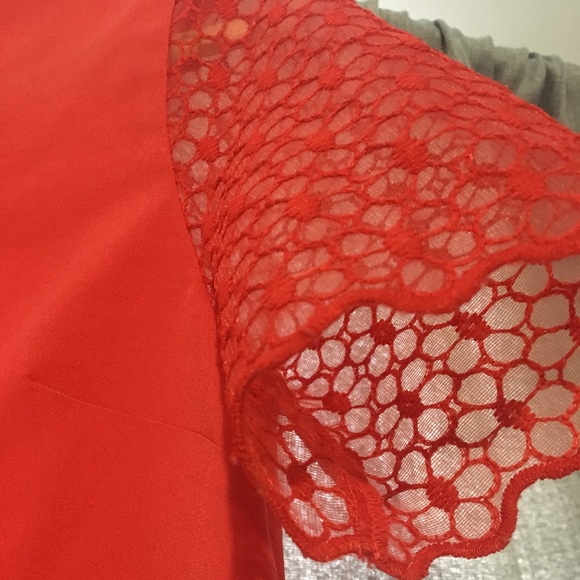 Red t-shirt with a mesh floral design sleeve. - Picture 2 of 2